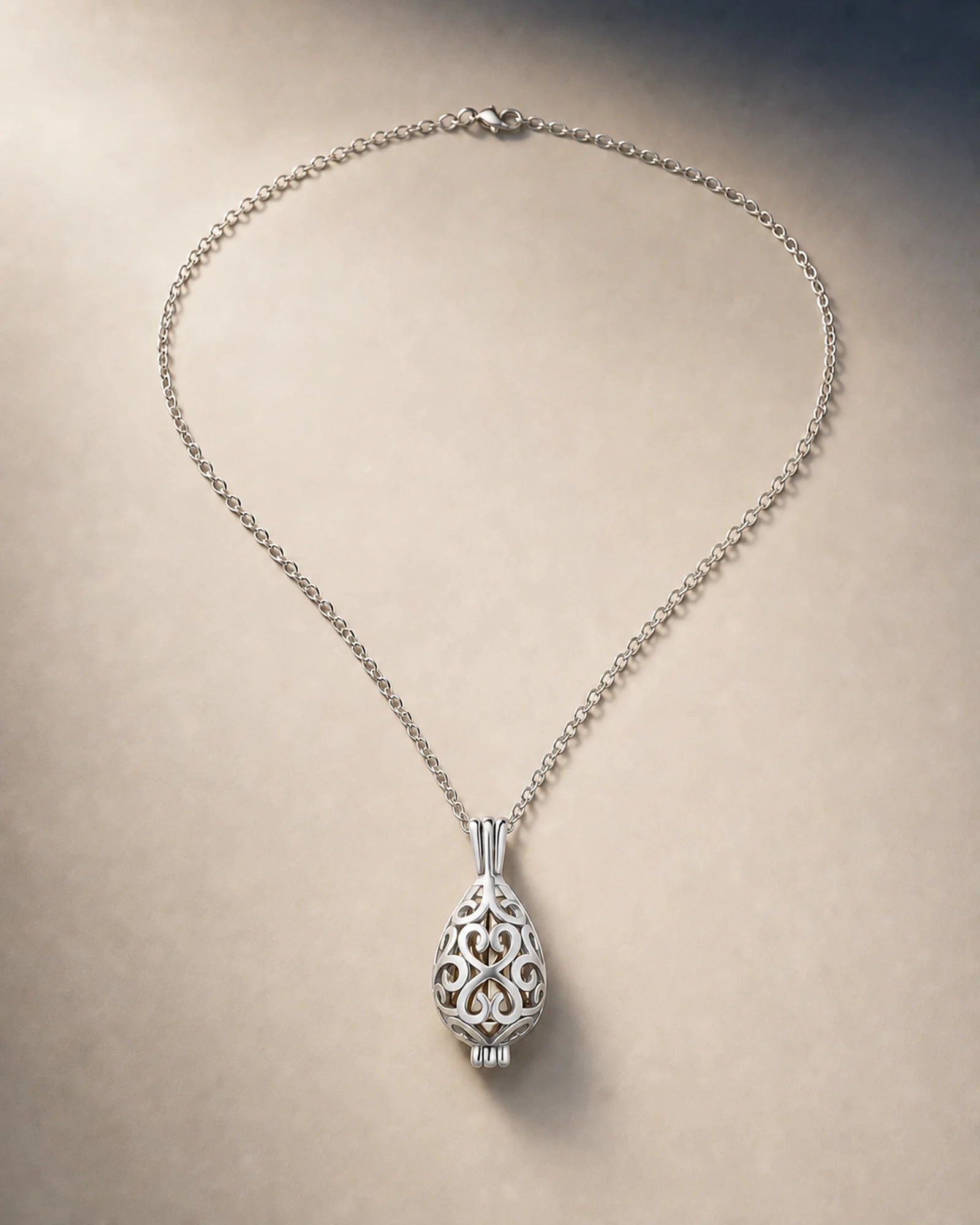Silver openwork lotus keepsake necklace with a secure threaded inner closure