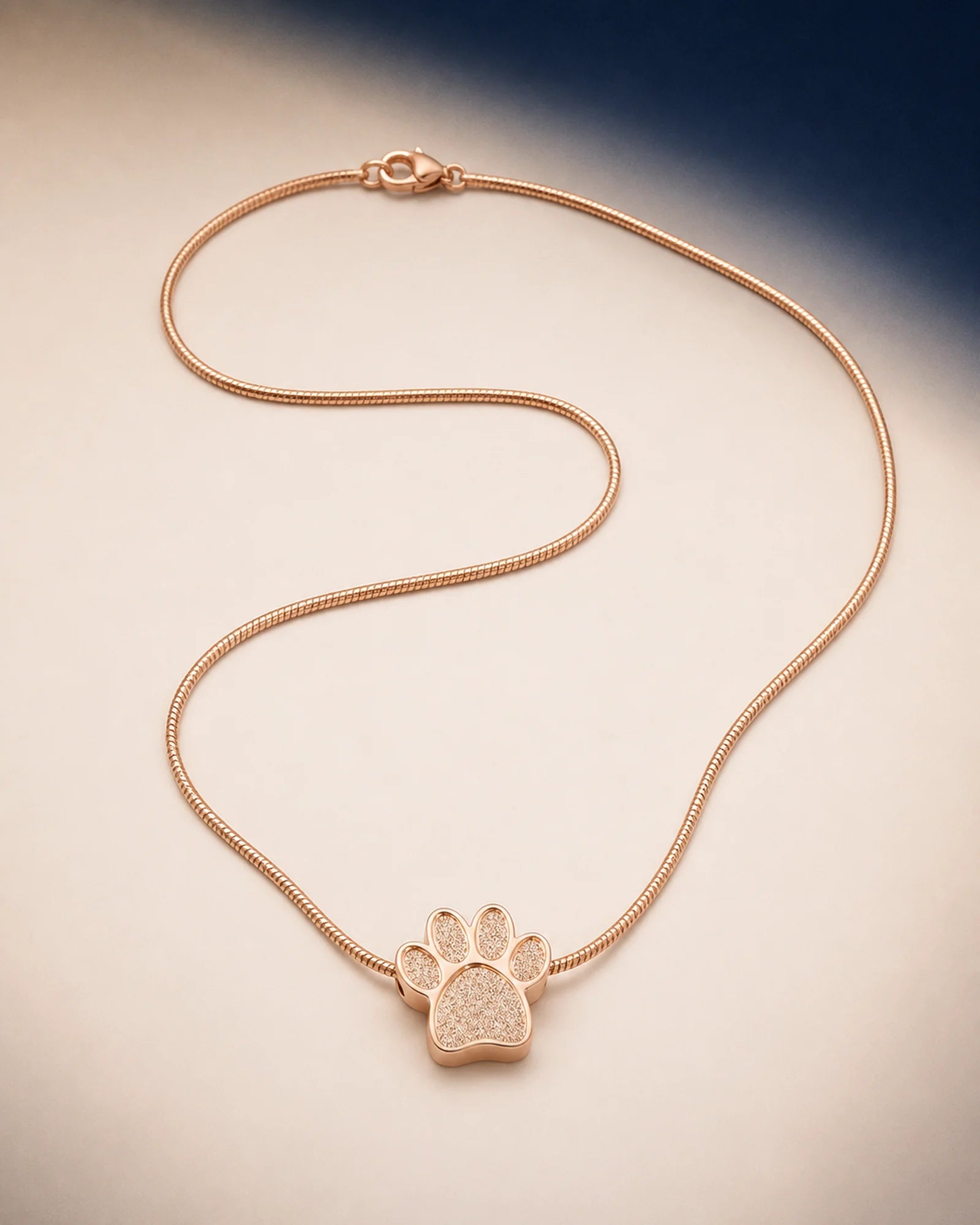 Small rose-gold square keepsake necklace with a paw-shaped center