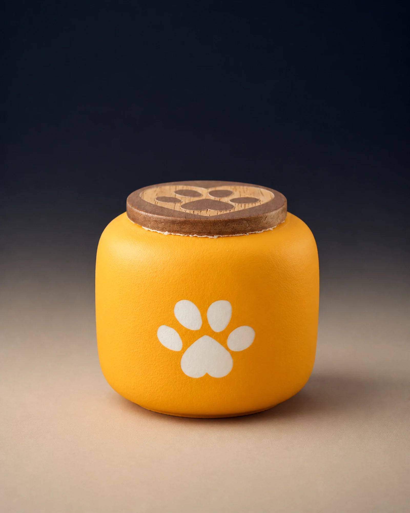 Yellow 180 mL pawprint memorial urn with a wooden lid