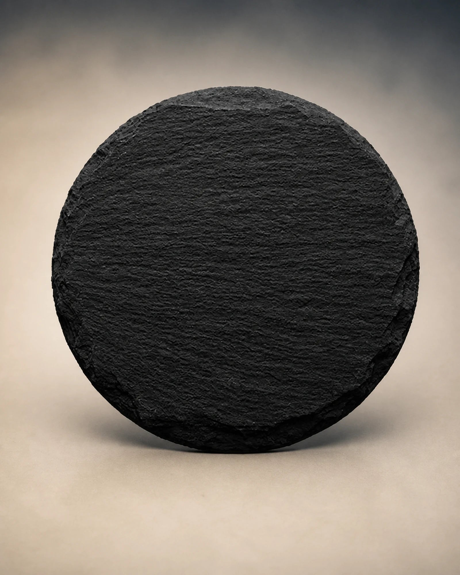 Blank round dark slate prepared for photo personalization